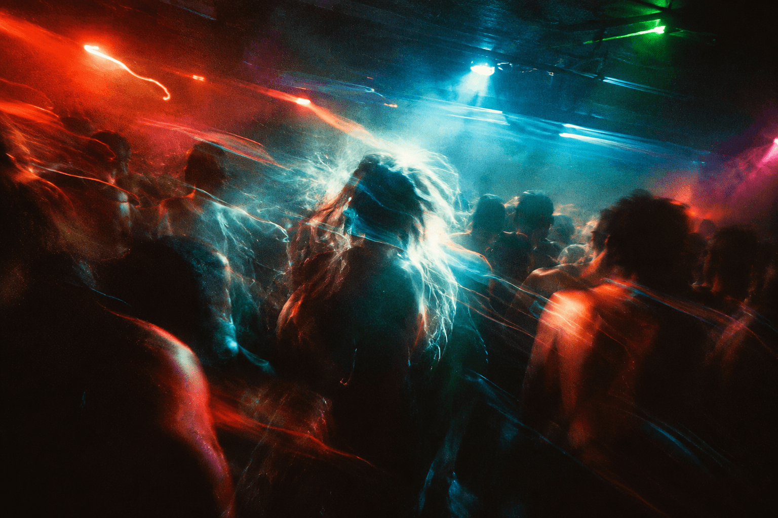 Crowd reduced to streaks of saturated club light